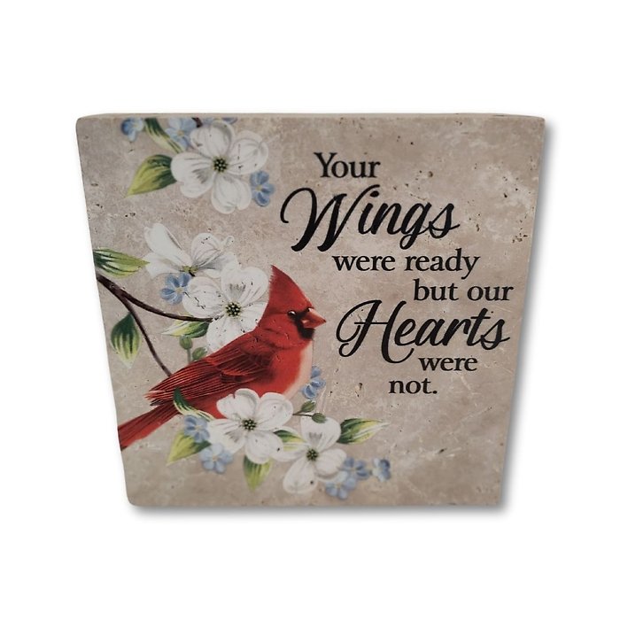 small stone with words and red birds